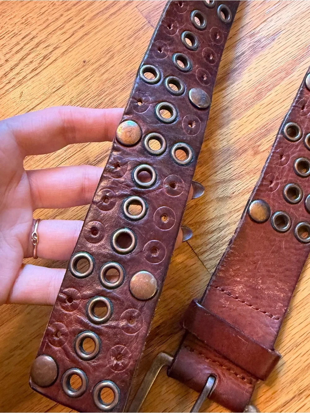 Vintage studded brown belt size large with grommet details real leather